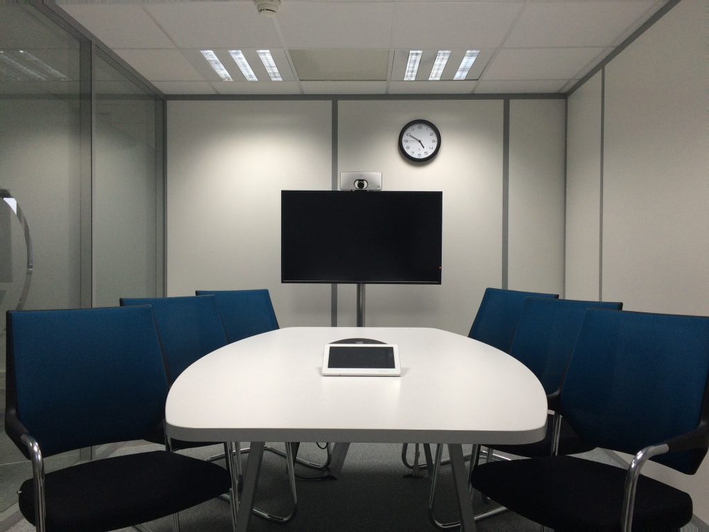 An empty conference room to represent the teleconference.